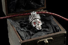Santa Muerte skull pendant in 925 sterling silver with an ornate crown and red cubic zirconia eyes by Yeti Jewelry
