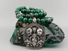 See No Evil skull necklace with natural green malachite beads, an ornate 925 sterling silver pendant featuring three skulls, and green cubic zirconia accents.