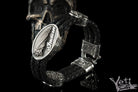 Indian Chief leather bracelet with a braided leather band, 925 sterling silver ornamental fittings, and an oval feather headdress centerpiece.