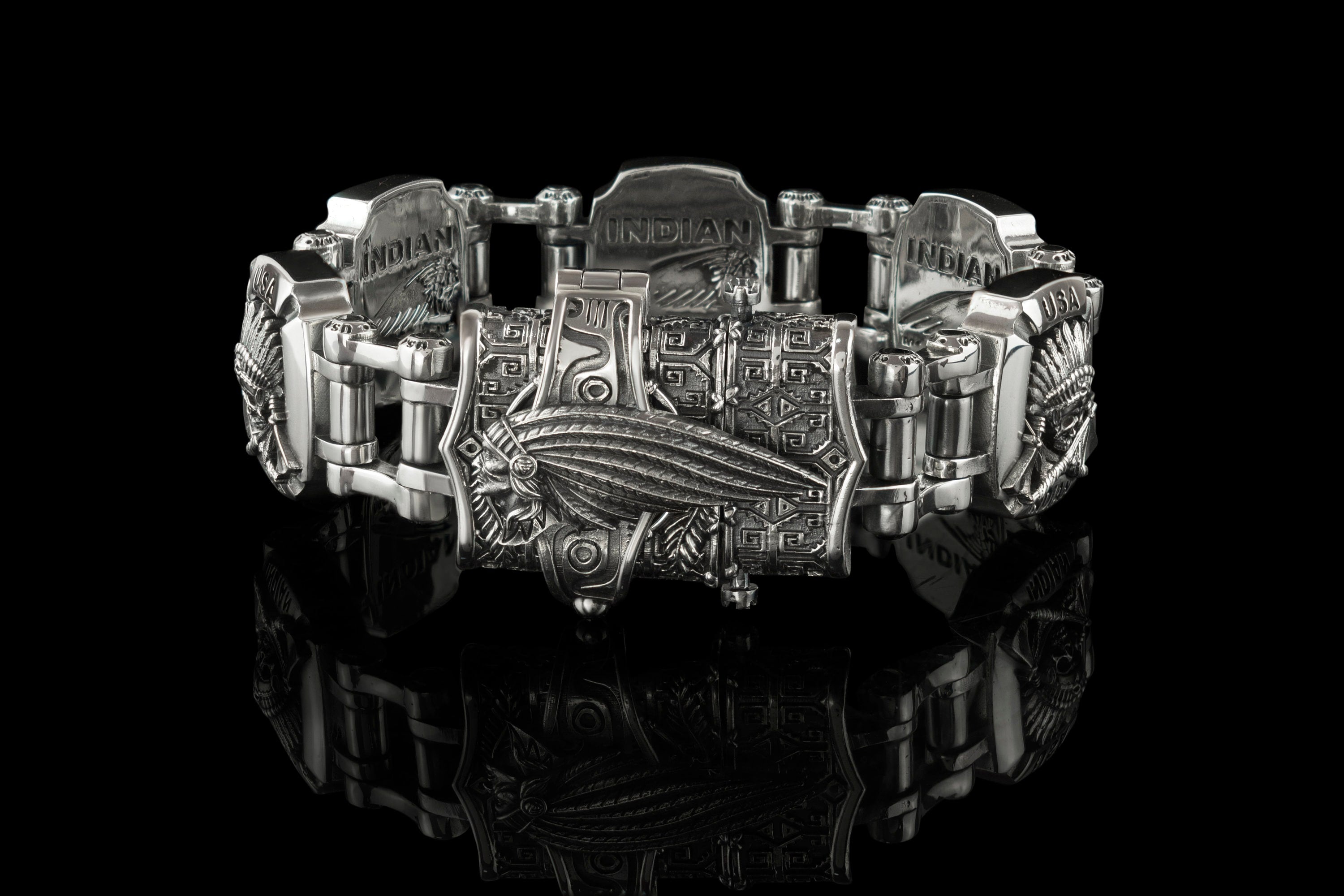 Heavy silver biker bracelet side view on black background