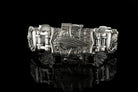 Close-up of the INDIAN lettering plate on the heavy silver bracelet