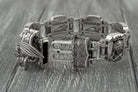 Indian heavy bracelet laid straight, engraved plate details
