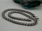 Kardinal biker chain draped, side view of the 10 mm links