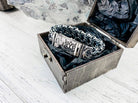 Kardinal sterling silver bracelet clasp detail inside a box