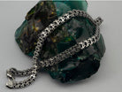 Heavy men's silver chain with oxidized Byzantine links, angled view