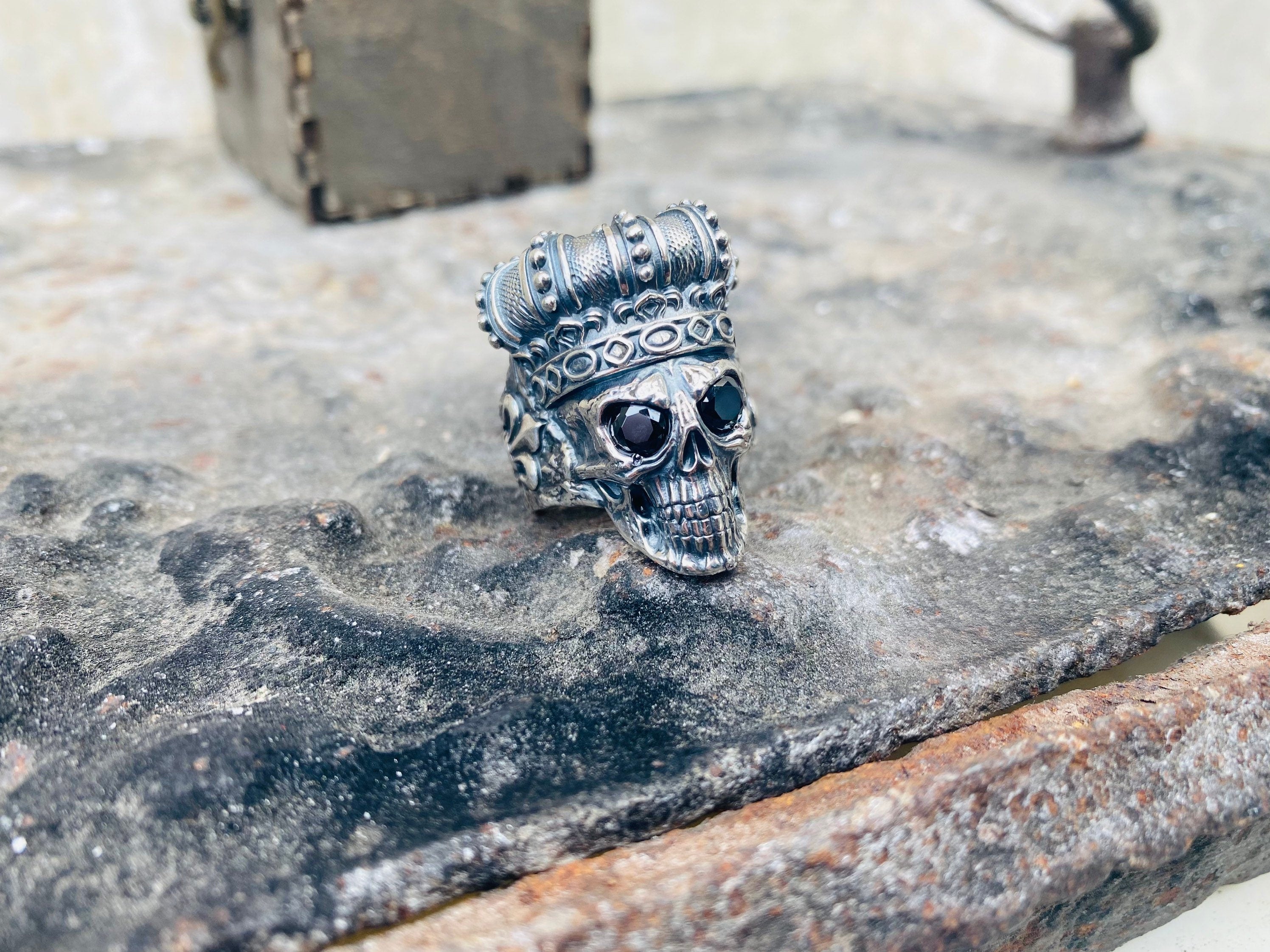 Crowned skull ring side view showing the textured crown
