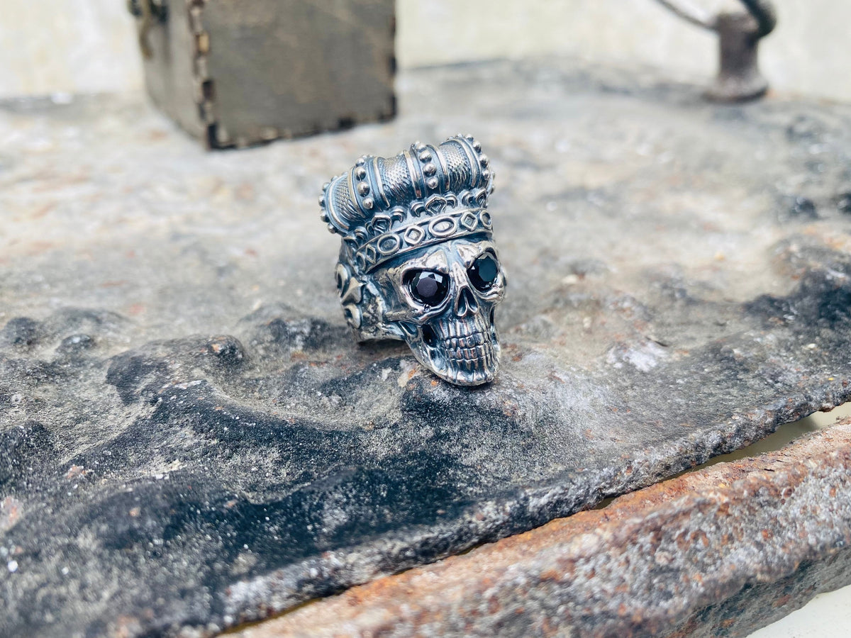 Crowned skull ring side view showing the textured crown