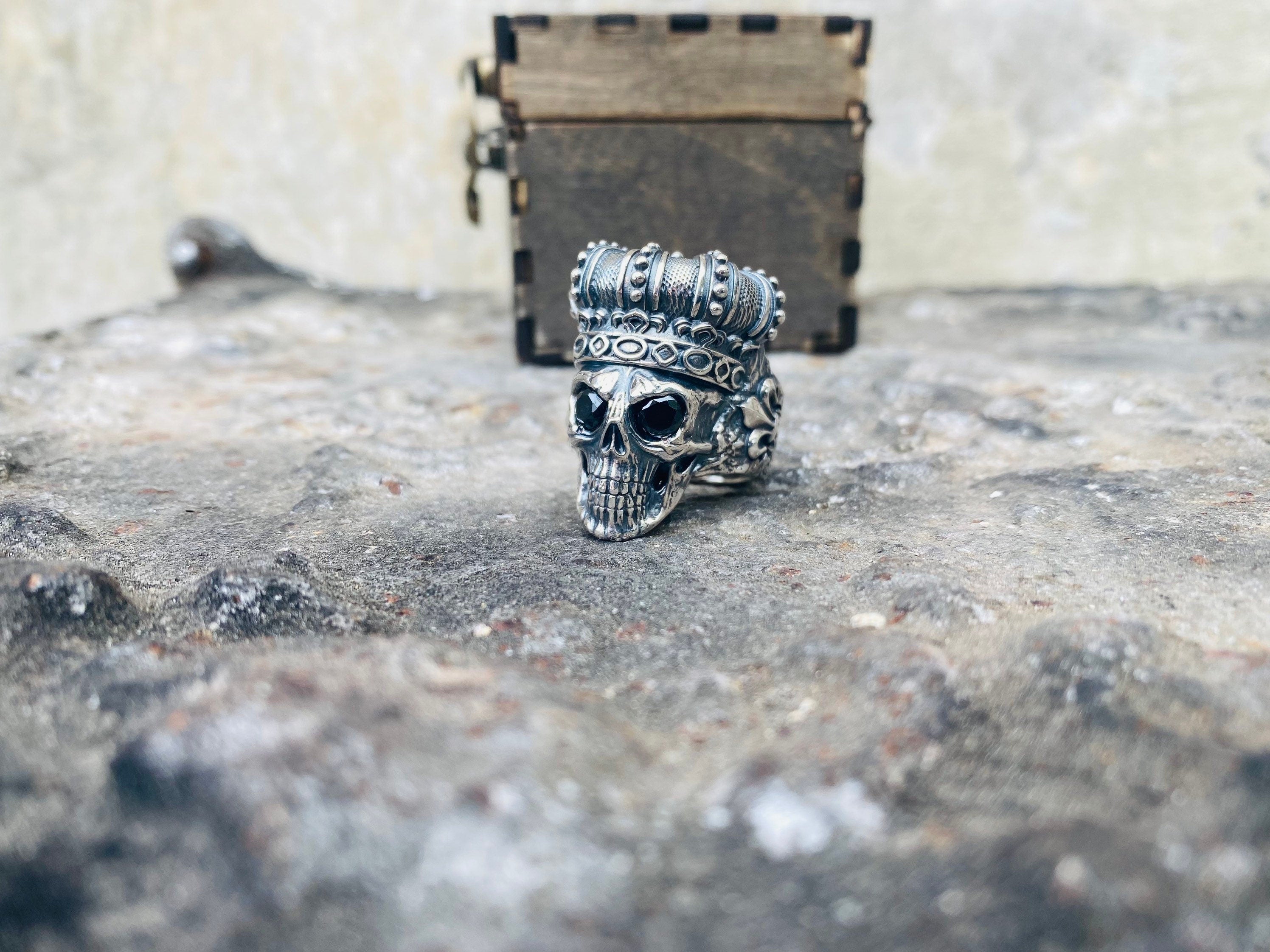 Oxidized silver crowned skull ring, other side view