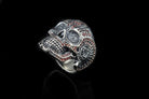 Close-up of the ornate calavera skull face on the silver ring