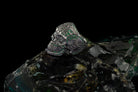 Green stone calavera ring, angled view of the ornate skull