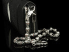 Silver skull biker wallet chain attached to a leather wallet, side view