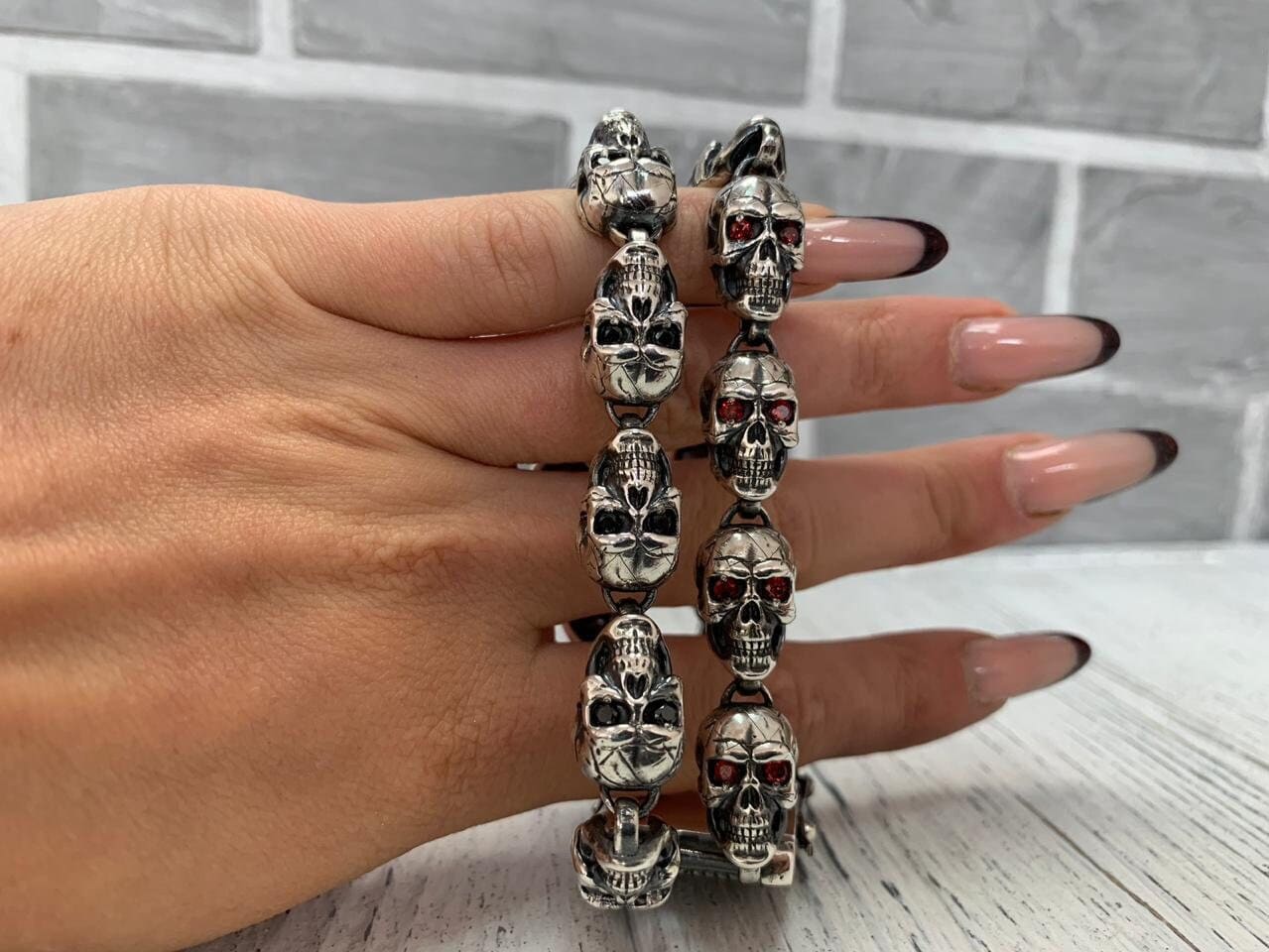 Mitchell double-row skull bracelet held over a hand to show its size
