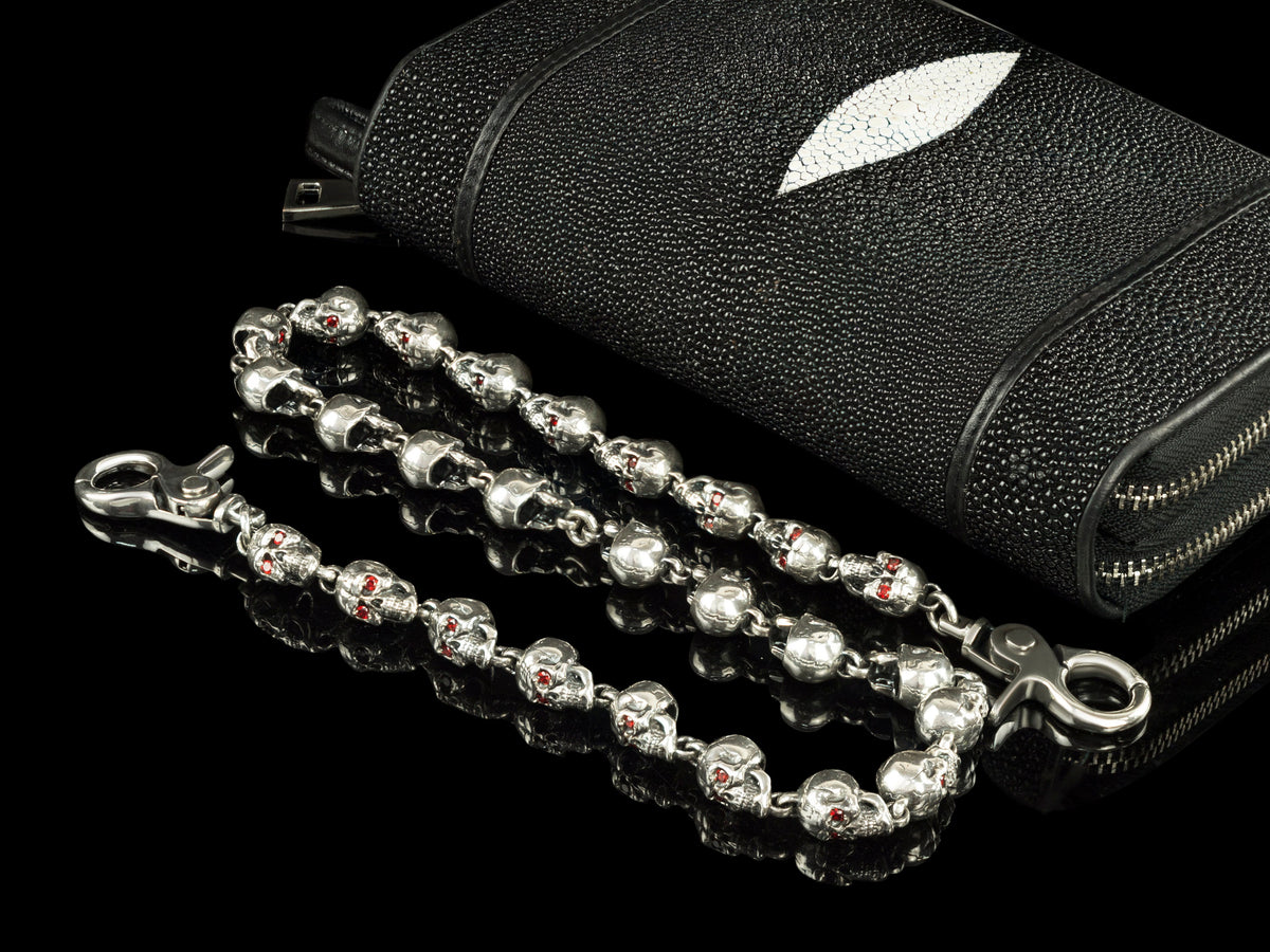 Two strands of the Mitchell skull wallet chain on black leather