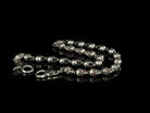 Close-up of 3D skull links and snap hook on the Mitchell biker chain