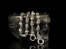 Mitchell wallet chain hanging in loops, sculpted skull links and snap hook