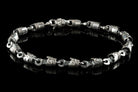 Men's silver piston bracelet laid flat, showing lobster clasp and piston links