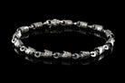 Full view of the piston and rod bracelet with lobster clasp on black background