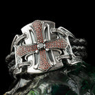 Close-up of the pave cross and center stone resting on a green stone