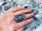 Women's gothic ring with cubic zirconia cross pattern worn on the index finger