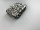 Relic lighter case lid detail with cathedral ornament