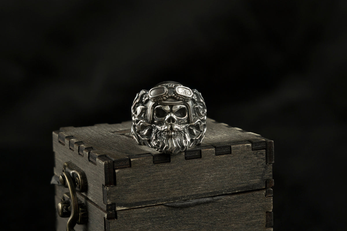 Rider skull ring front view, bearded skull and goggles in oxidized silver