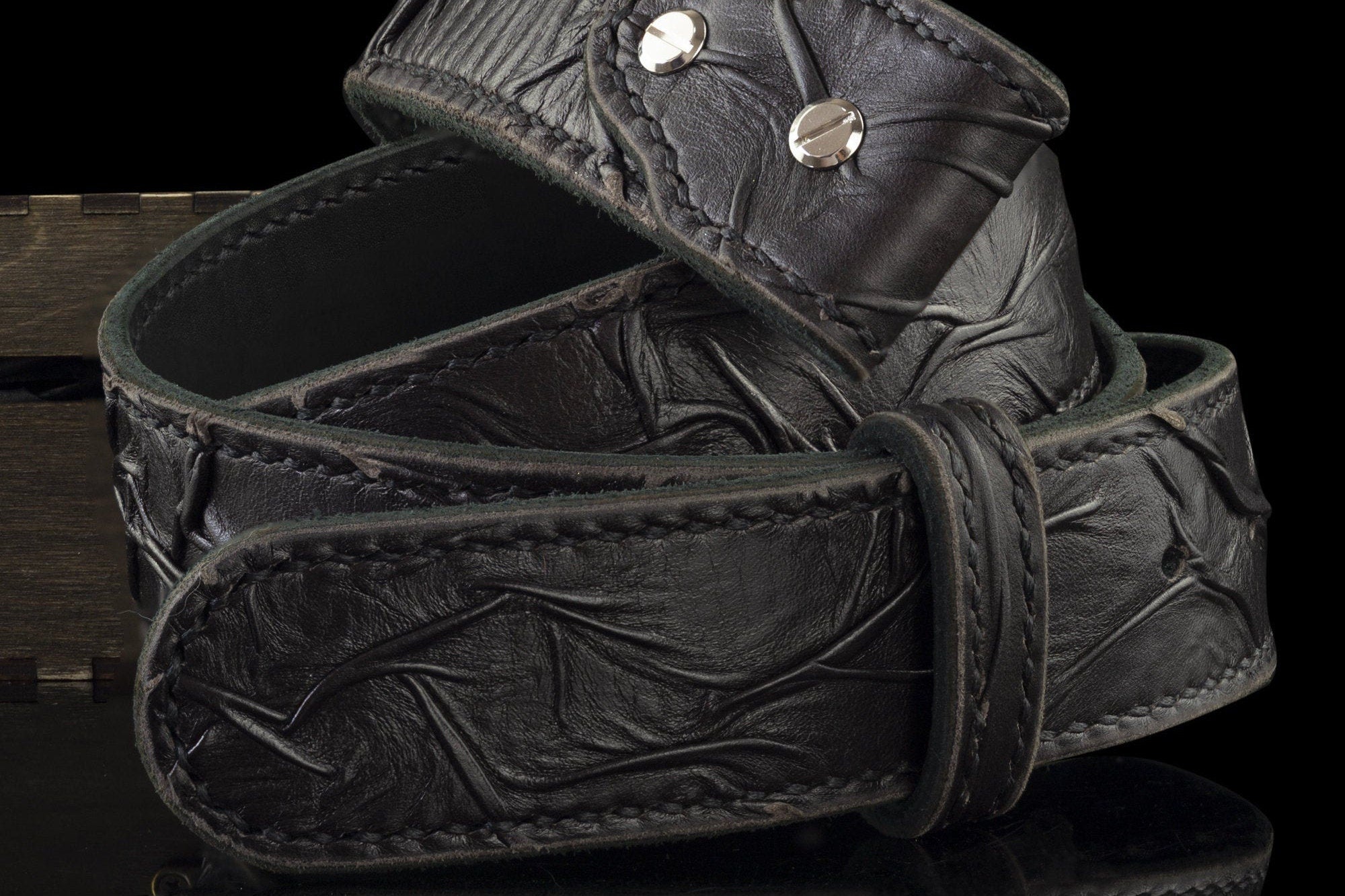 Black genuine leather belt strap looped, side view of the 4.5 mm edge