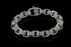 Heavy men's sterling silver bracelet with oxidized high-relief ornament on every link