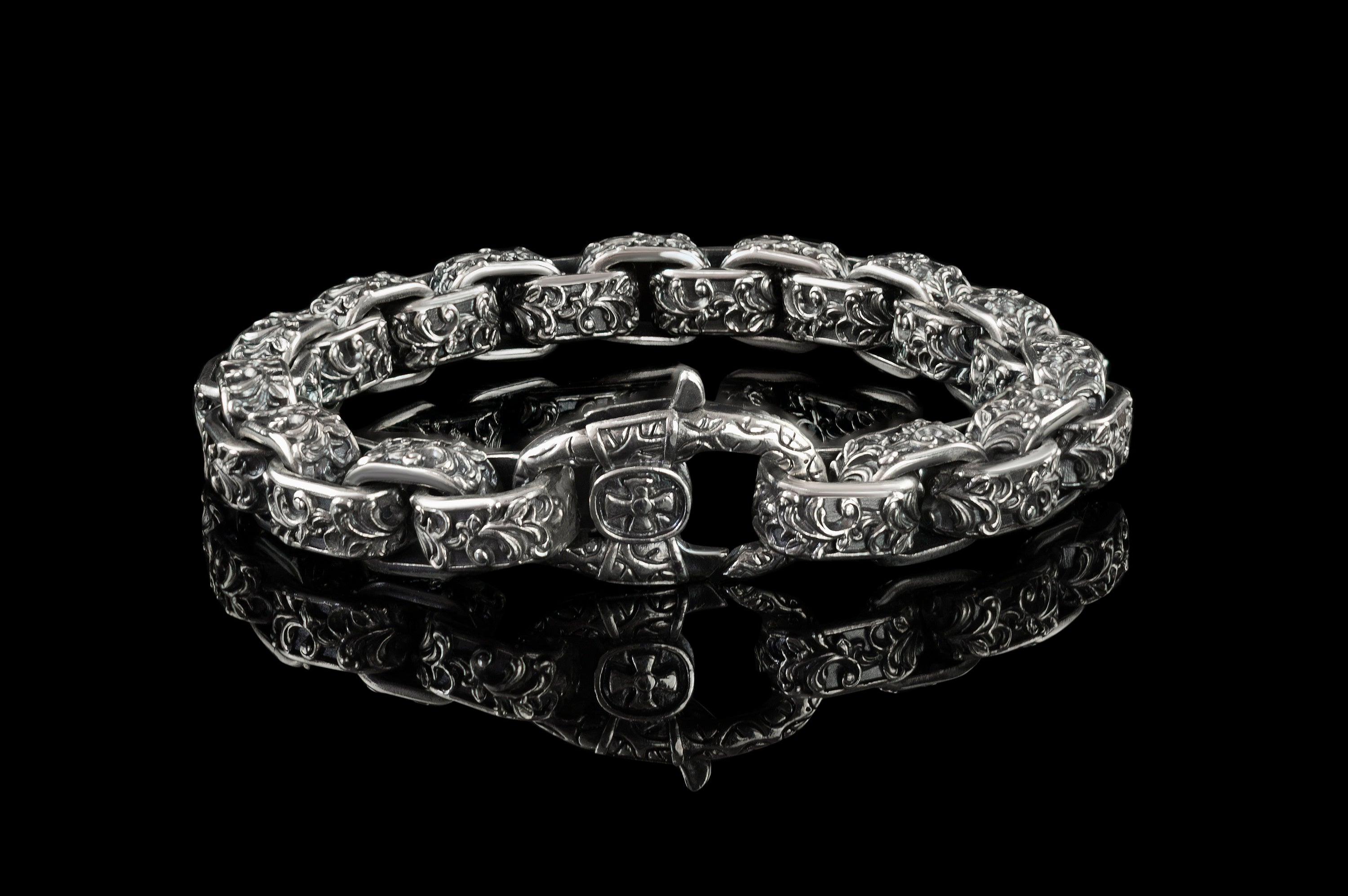 Rory silver box link bracelet showing the cross emblem lobster clasp, front view