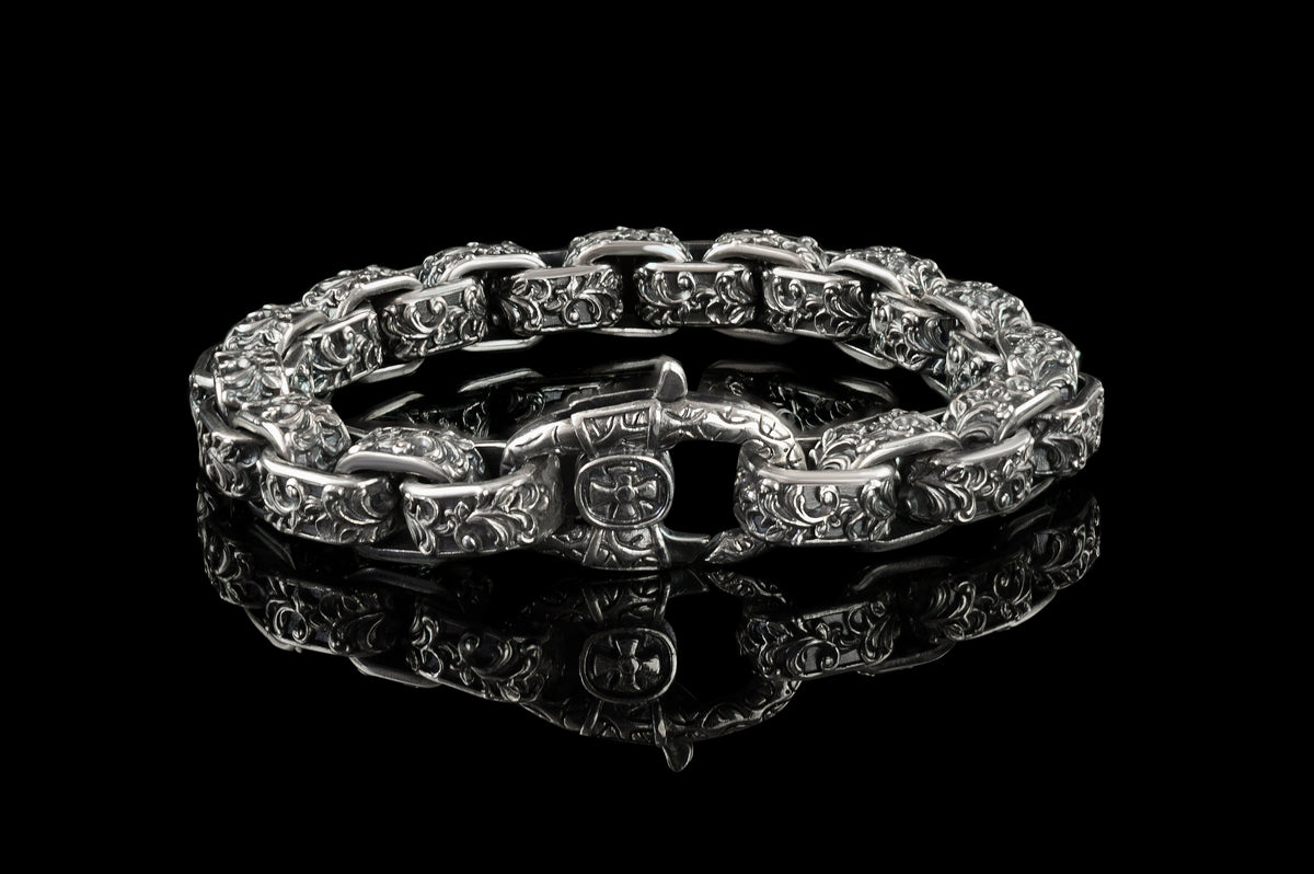 Rory silver box link bracelet showing the cross emblem lobster clasp, front view