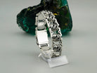 Royal Blessing bracelet standing upright, showing the polished back of the box clasp