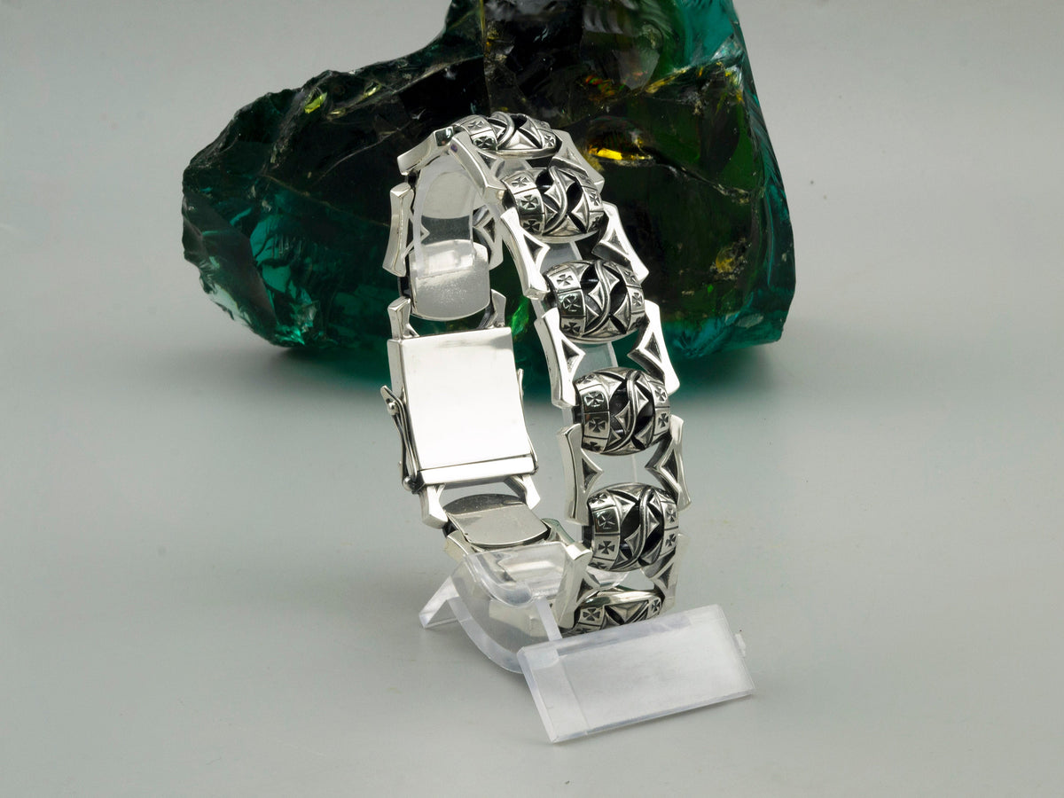 Royal Blessing bracelet standing upright, showing the polished back of the box clasp