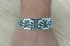 Royal Blessing Maltese cross silver bracelet worn on the wrist
