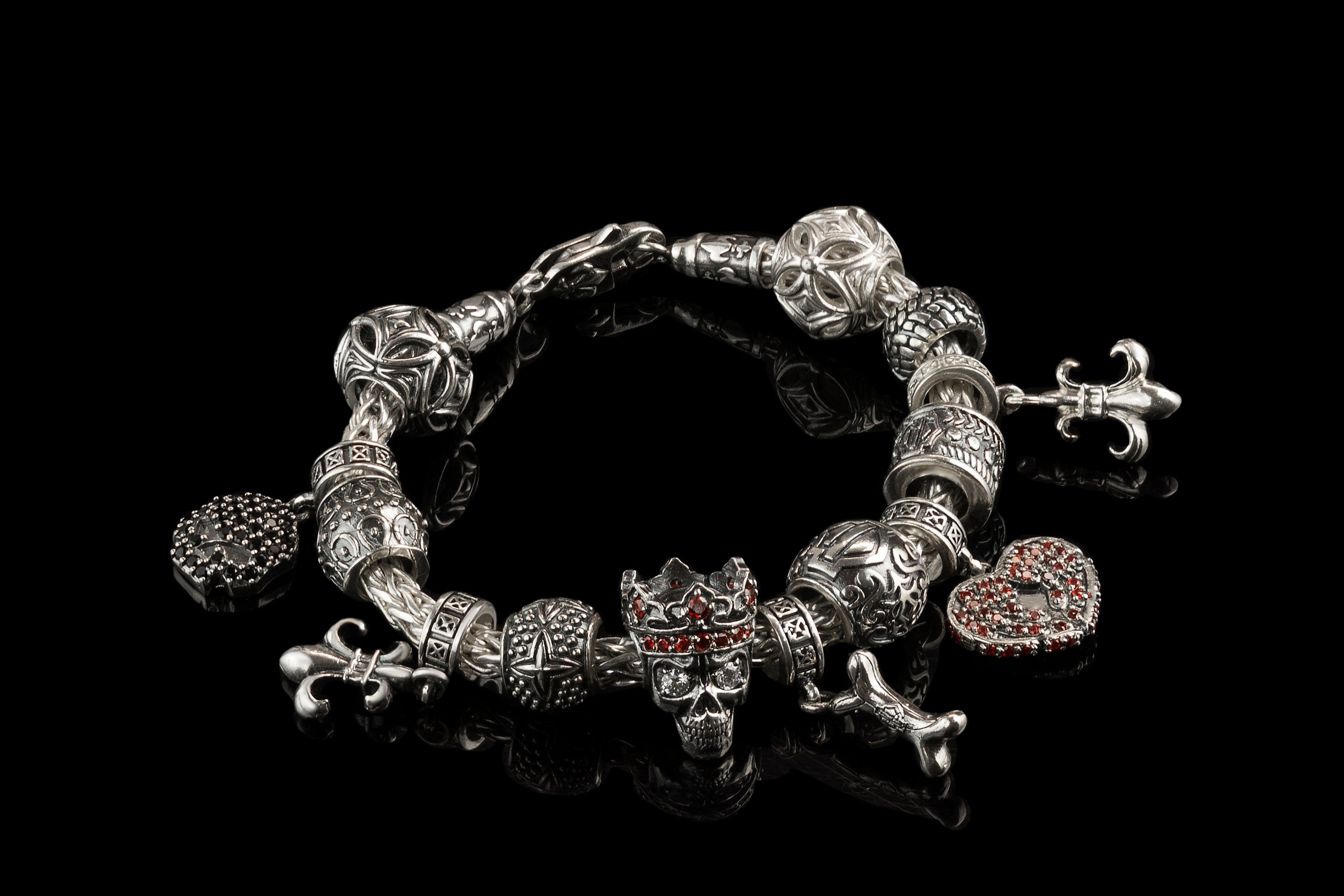 Crowned skull charm bead styled on a silver charm bracelet with other beads (bracelet not included)