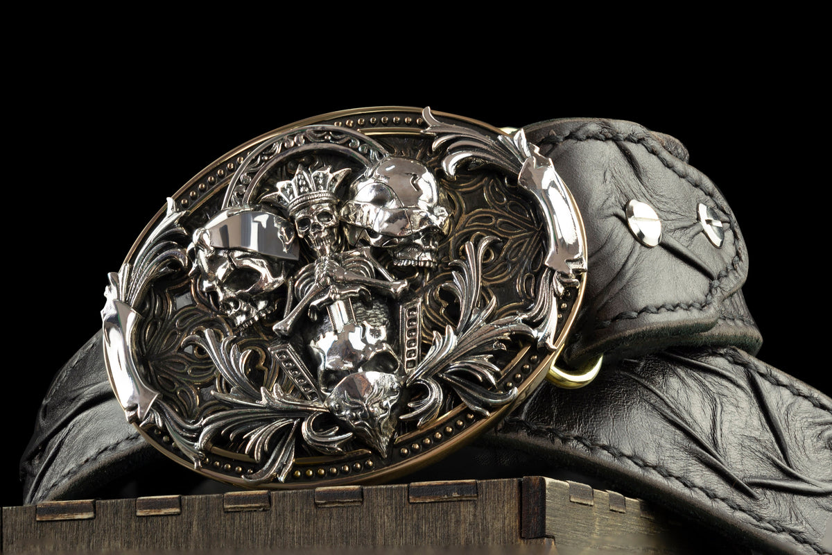 Close-up of the three skulls on the See No Evil belt buckle