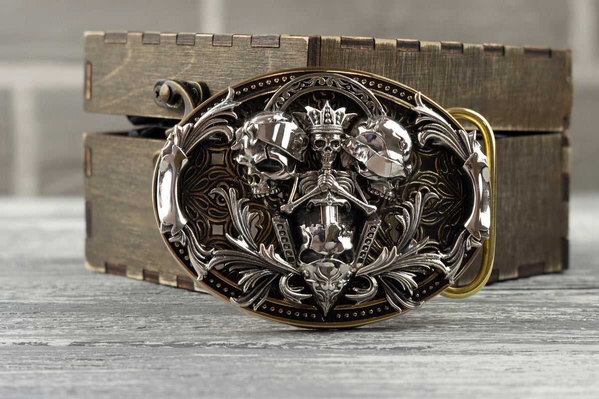See No Evil skull belt buckle in sterling silver and brass, front view