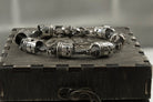 Skull piston bracelet across the lid of a wooden gift box