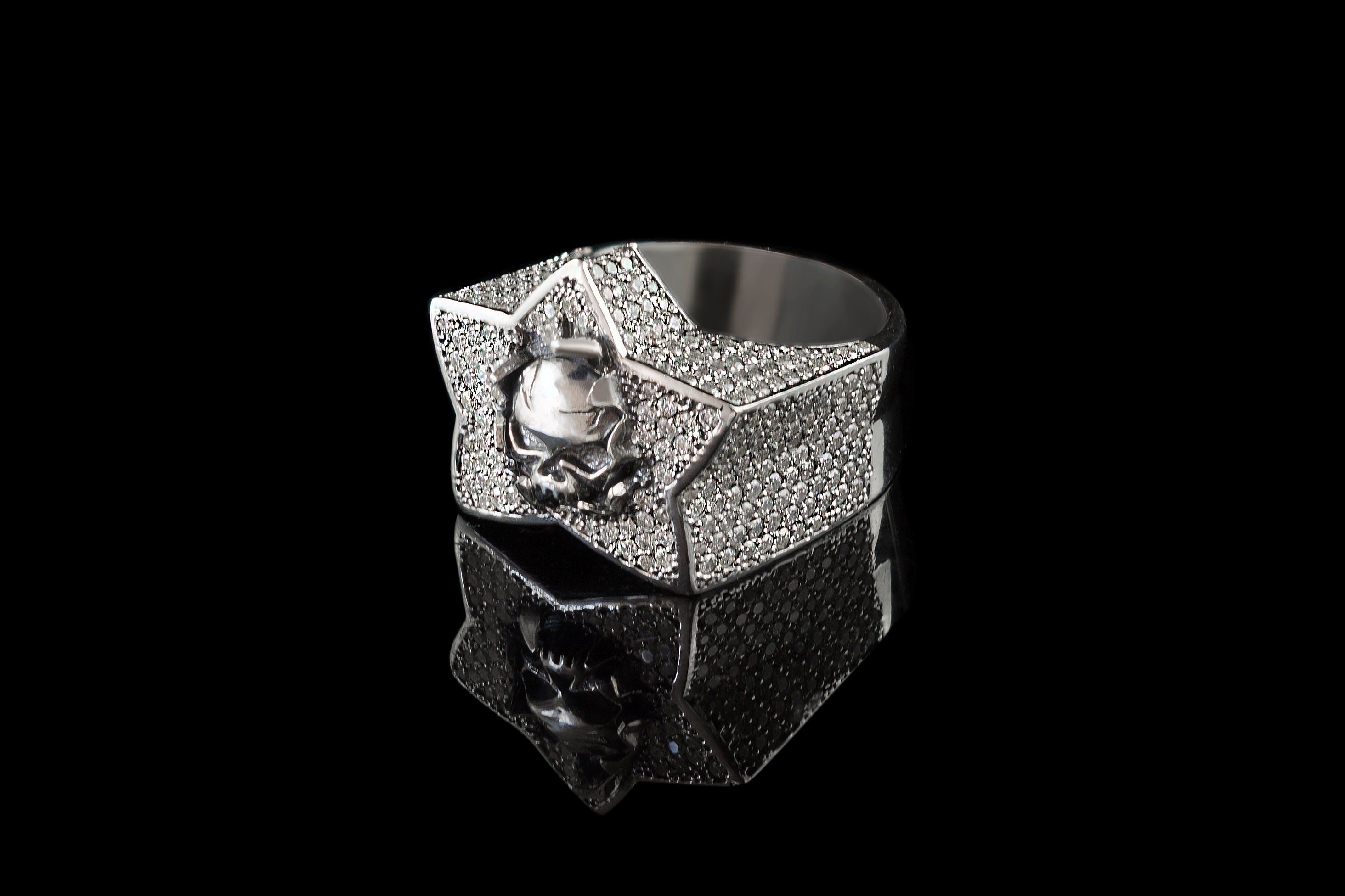Sky's The Limit pave star ring with central skull, angled view