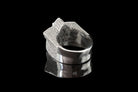 Side view of the clear CZ star skull ring and silver band