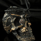 Tiny Frida sterling silver floral skull pendant with red stone eyes, on skull