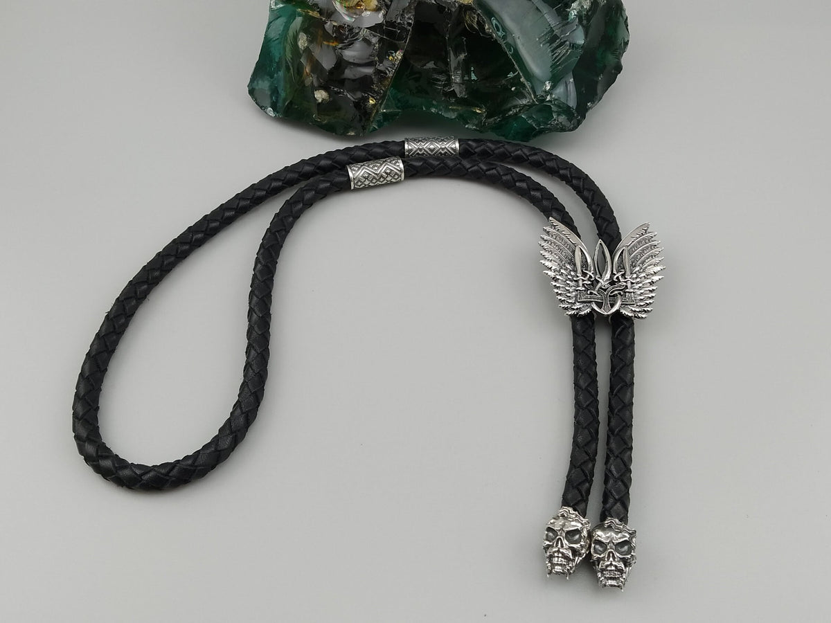 Winged Tryzub sterling silver bolo tie on braided black leather cord with skull tips
