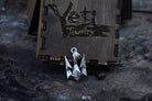Ukrainian trident pendant lying on a wooden box