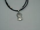 Sterling silver pendant of a Ukrainian woman with a floral wreath, detail 3