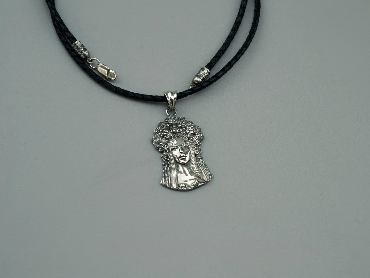 Sterling silver pendant of a Ukrainian woman with a floral wreath, detail 3