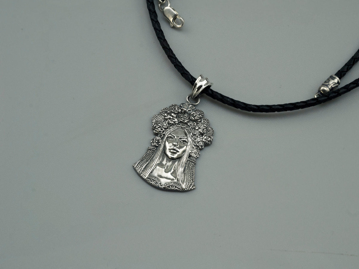 Sterling silver pendant of a Ukrainian woman with a floral wreath, detail 4