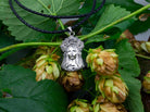 Sterling silver pendant of a Ukrainian woman with a floral wreath, detail