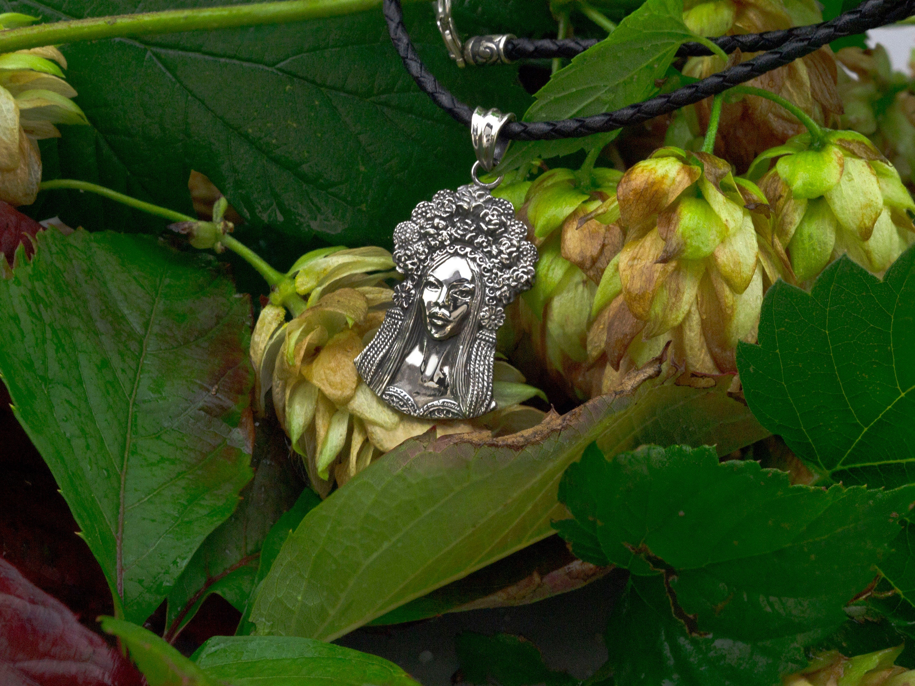 Sterling silver pendant of a Ukrainian woman with a floral wreath, on cord