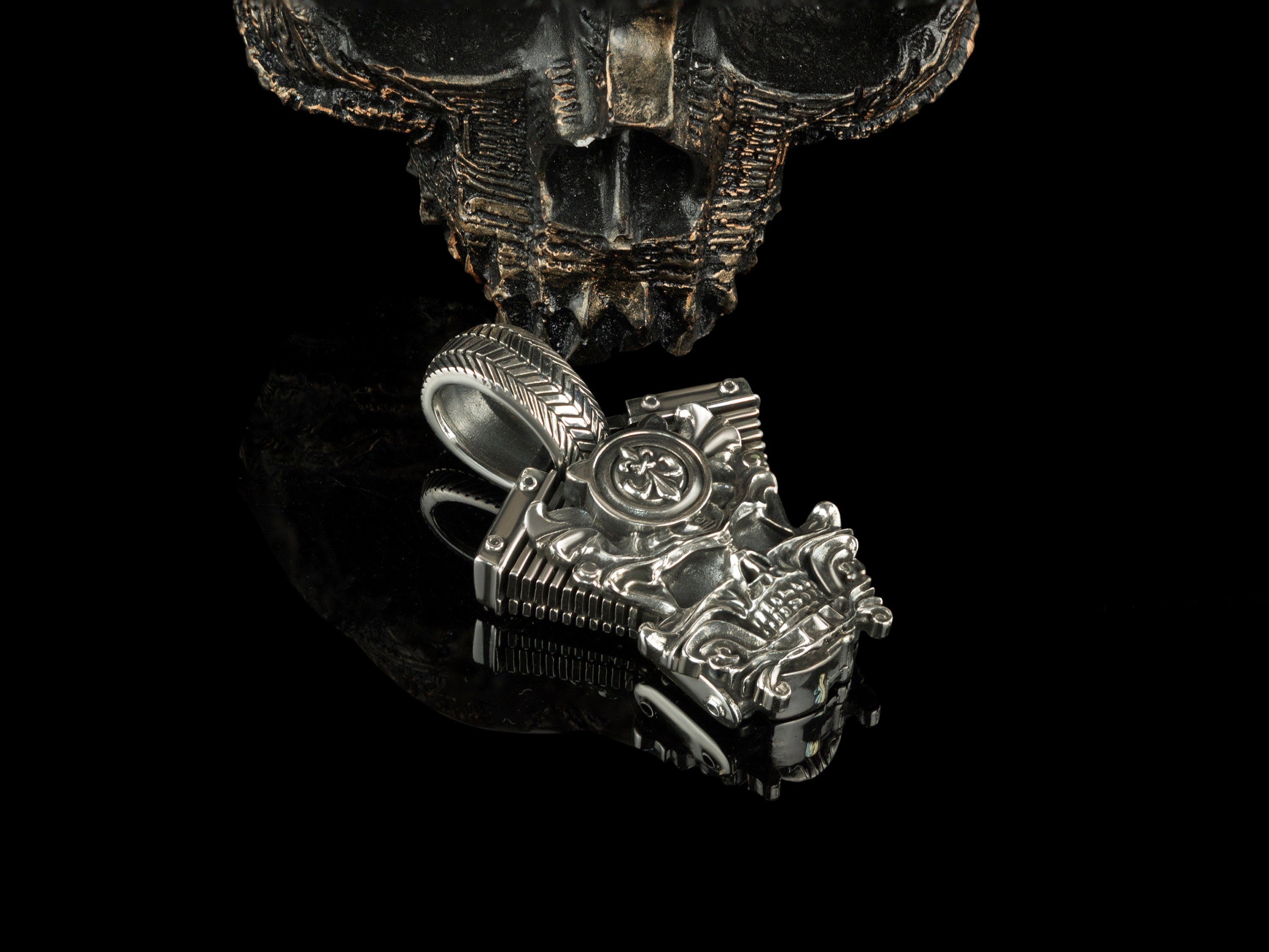Vigor motorcycle skull pendant on black, side angle