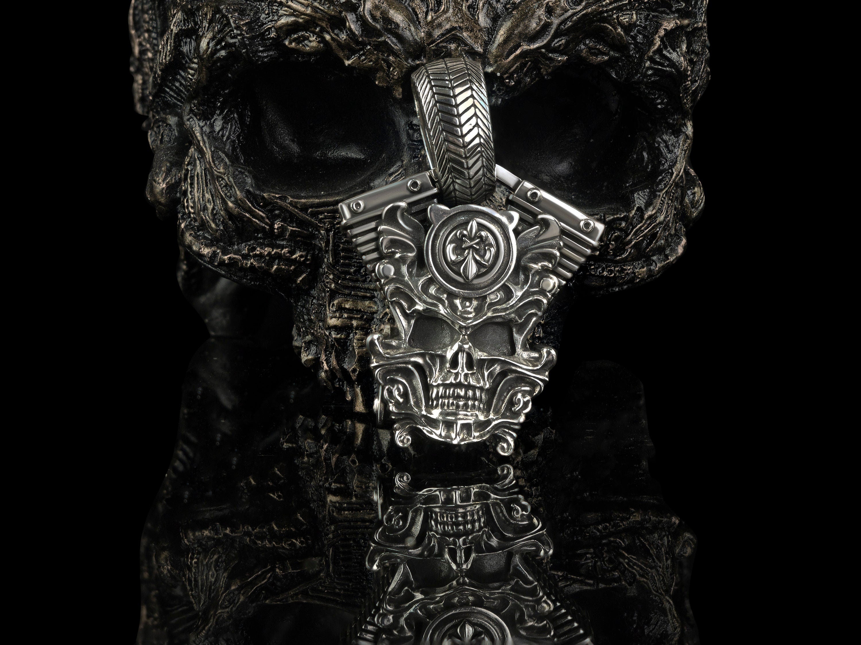 Vigor skull pendant on black background, front view