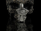 Vigor skull pendant on black background, front view