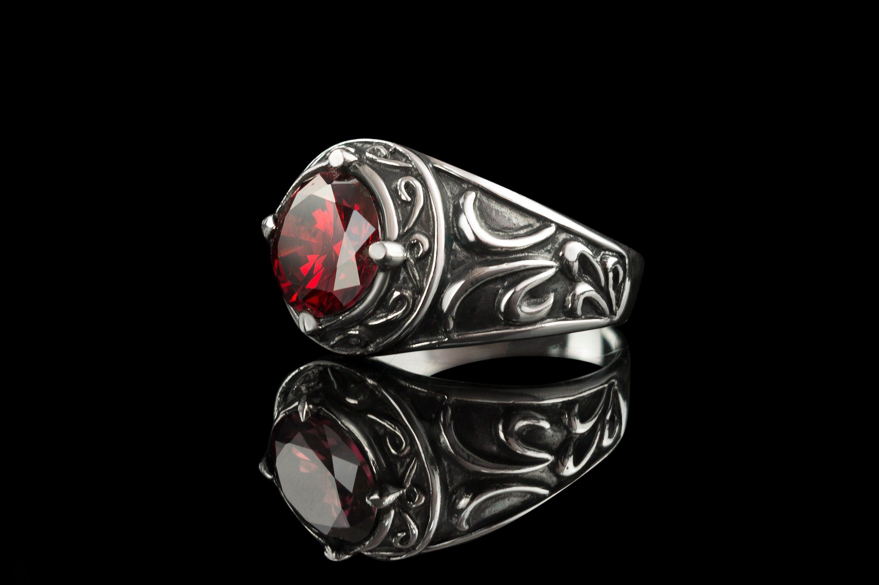 Men's Viking silver ring with red stone, opposite angle with reflection